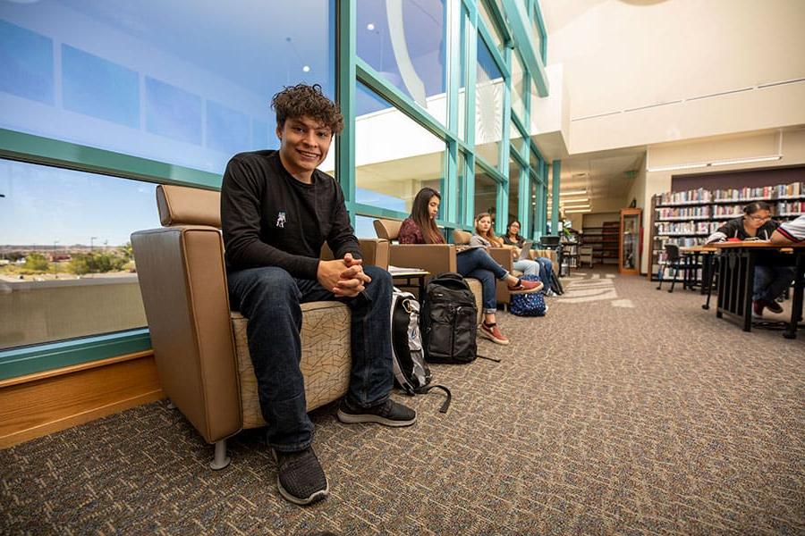 A student sitting down in the library